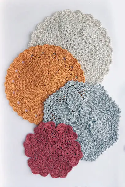 Assorted multicolor doilies pattern that used to be coaster, napkin or tablecloth