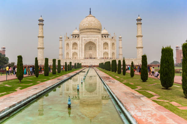 istock Historic Taj Mahal monument with reflection in the pond in Agra 1350149478