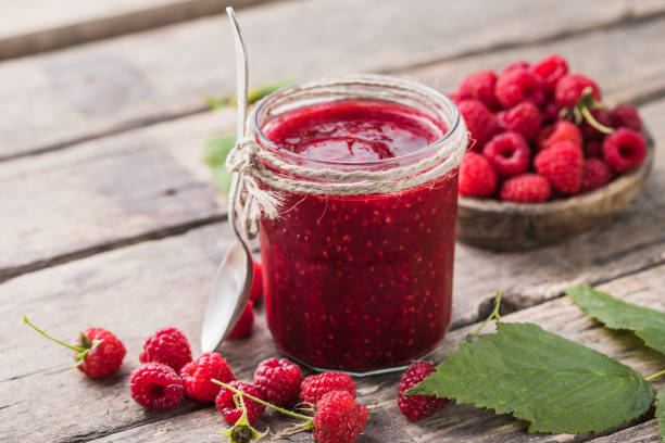 istock homemade raspberry jam on a wooden background with fresh raspberries, selective focus. 1350155525