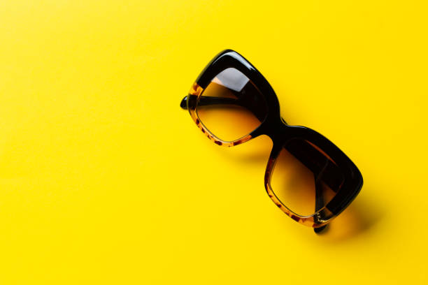 istock Sunglasses on a yellow background. UV protection. 1350158221