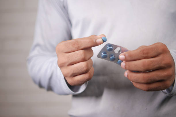 istock young man hand holding blister packs taking medicine 1350159718