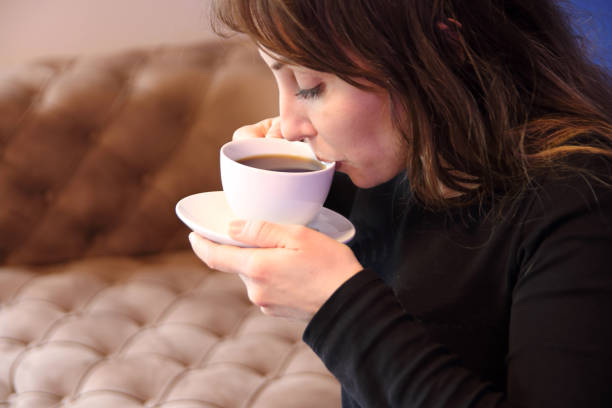 istock Beautiful women drinking hot coffee 1350170396