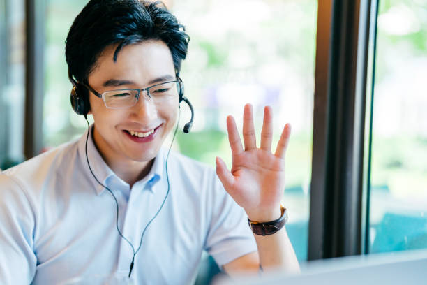 istock Asian  young man having video call on laptop. 1350171264