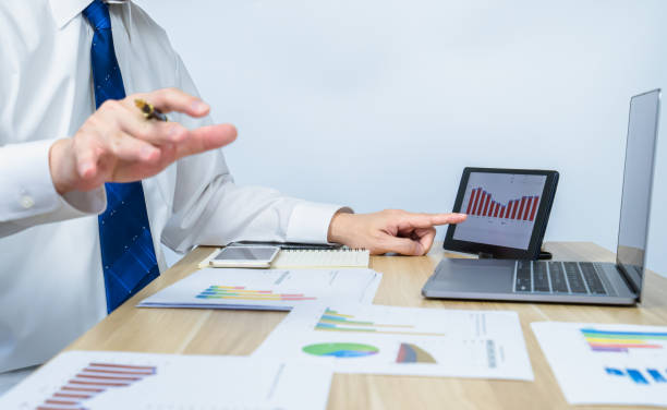 istock executive ​meeting and showing data graph on tablet on working desk 1350172715