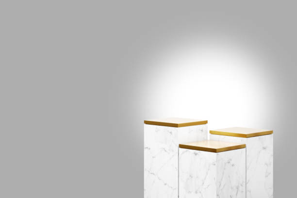 istock Cube step white marble podium and a metallic gold top with colored background in luxury studio scene. 1350173654