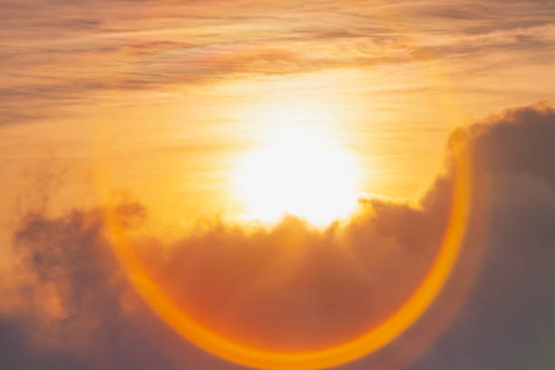 gold, red, yellow sunlight of sun while sunrise or sunset with soft white cloud on sky for wallpaper or background - dreams cloud angel heaven imagens e fotografias de stock