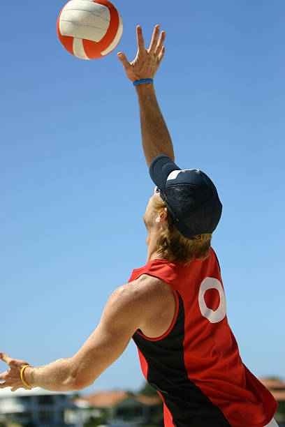 Beach VolleyBall Beach Volleyball Player spiking ball closeup male volleyball player stock pictures, royalty-free photos & images