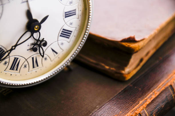 istock Analog Clock on Vintage Books 1350176927