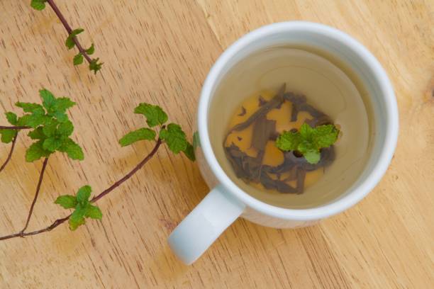 istock Green tea with mint leaves 1350179702