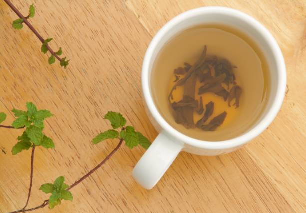 istock Green tea and mint leaves 1350179711