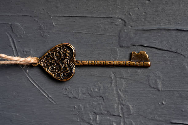 istock Vintage key on black background 1350180887