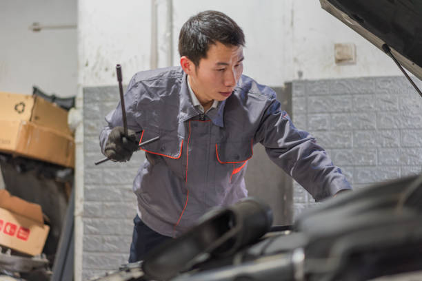 istock A car technician is repairing the car 1350187546