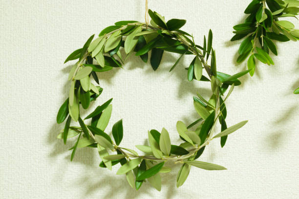 istock Wreath made of olive branches and leaves with a natural image 1350191078