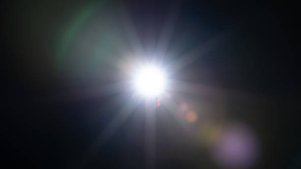 istock Sun flare on the black background 1350192588