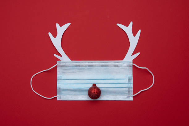 istock Festive christmas made from face mask and decorations 1350193369