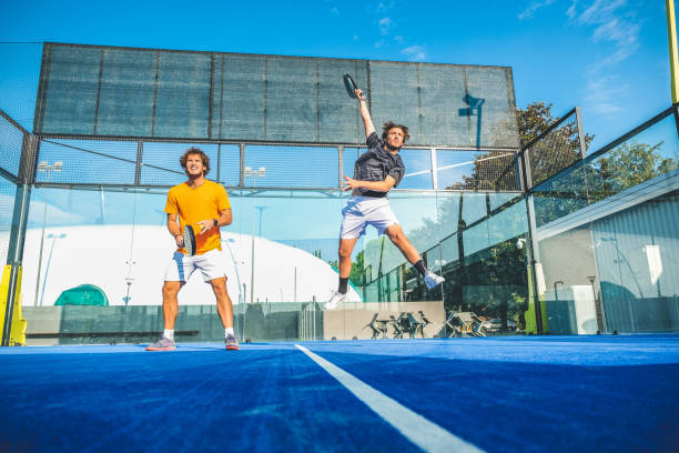 Mixed padel match in a blue grass padel court - 
Beautiful girl and handsome man playing padel outdoor Mixed padel match in a blue grass padel court - 
Beautiful girl and handsome man playing padel outdoor paddle ball stock pictures, royalty-free photos & images