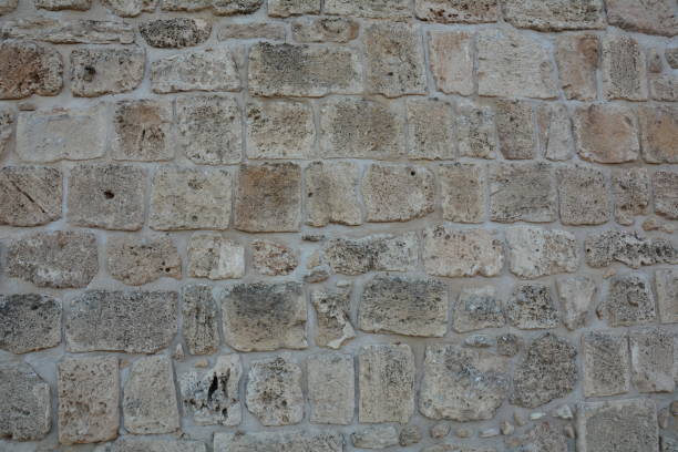 istock Texture of a stone wall. Old castle stone wall texture background. 1350194653