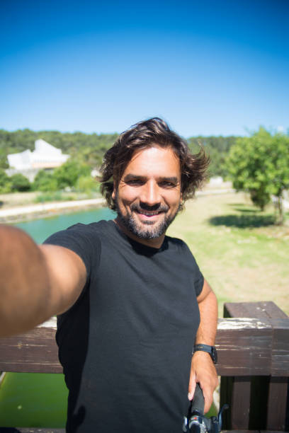 Handsome man taking selfie photo