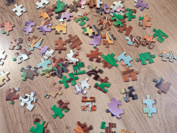 istock colorful puzzle pieces on a wooden background 1350196329