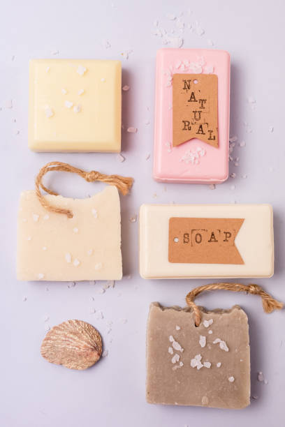 istock Variety of Natural Soaps on Blue Background Handmade Organic Soaps Vertical Flat Lay 1350197355