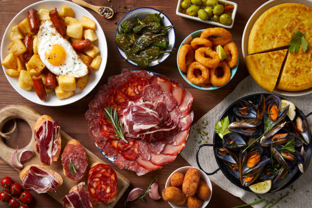 Spanish food A table with typical Spanish food seen from above on a wooden table espana stock pictures, royalty-free photos & images