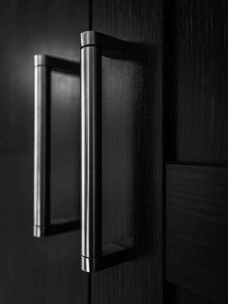 Nickel Accent Closet Door Handle set installed on black panel interior door
