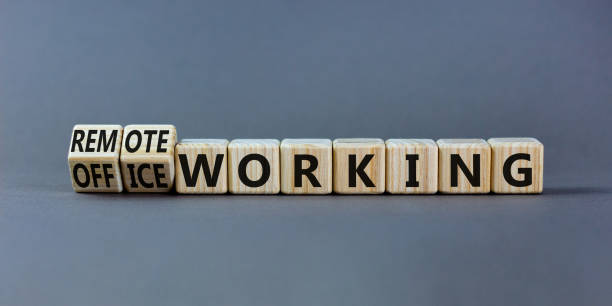 istock Office or remote working symbol. Turned wooden cubes and changed words 'remote working' to 'office working'. Beautiful grey background. Business, office or remote working concept, copy space. 1350200273