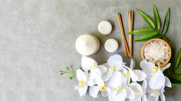 istock Thai Spa.  Massage spa and hot stones setting for treatment and relax with white orchid on blackboard.  Lifestyle Healthy Concept, 1350201417