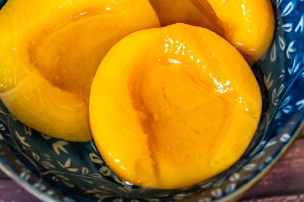 Canned peaches in a bowl