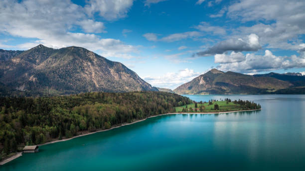 istock Lake Walchensee with blue cloudy sky from above, Bavaria 1350204563
