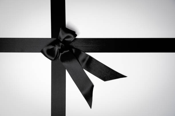 istock Black Friday or mourning concept with black ribbon bow 1350206037