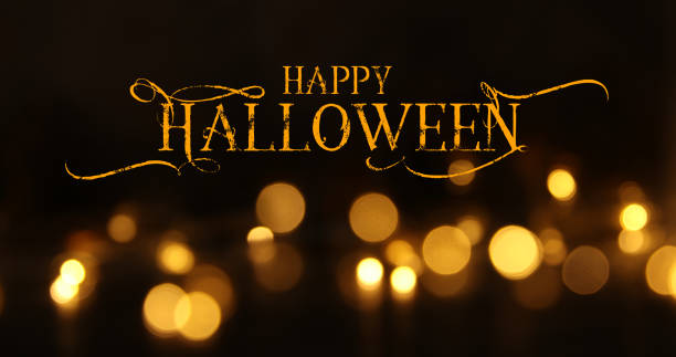 istock halloween image of gold glitter lights with text over black background. de focused 1350212973