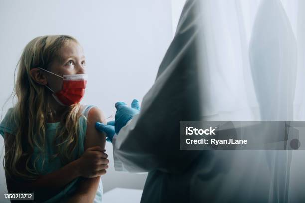 Child Receiving Vaccination Shot From Doctor Stock Photo - Download Image Now - Mandate, Vaccination, Protective Face Mask