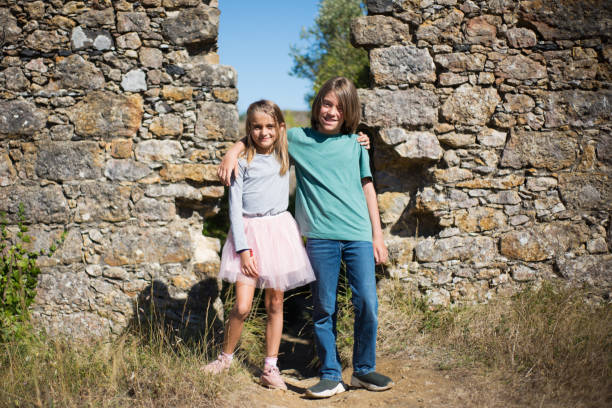 istock Cute little children next to big wall 1350214739