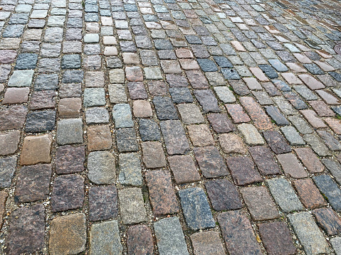 The old style pavement has become fashionable and quite expensive. This is the work of a skilled paver. The photo was taken October 26th, 2021 in Copenhagen, Denmark.