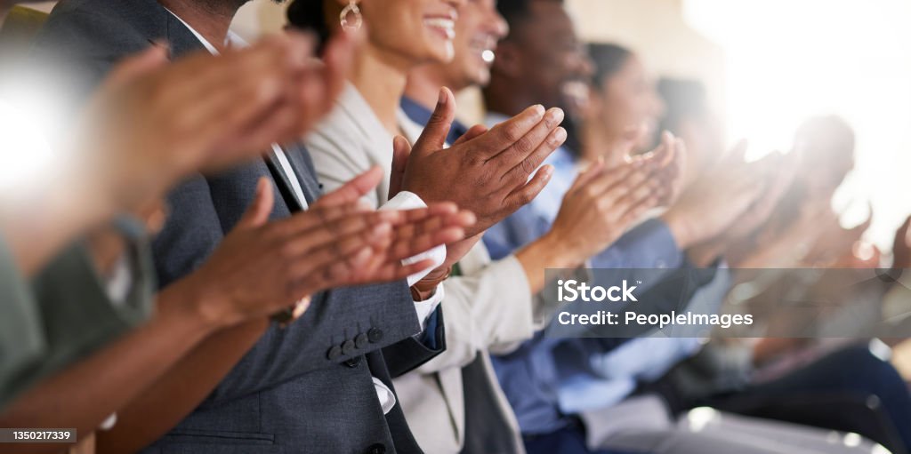 Cropped shot of an unrecognizable diverse group of businesspeople applauding while sitting in the boardroom during a presentation A round of applause Clapping Stock Photo