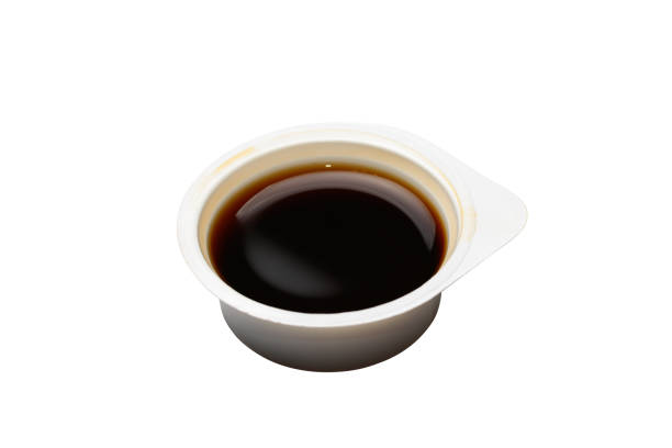istock Plastic open disposable container with soy sauce. Isolated on a white background 1350227052