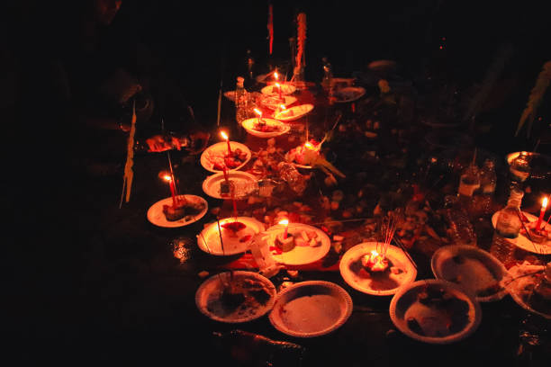 Candles and food offerings during the Pchum Ben Festival stock photo