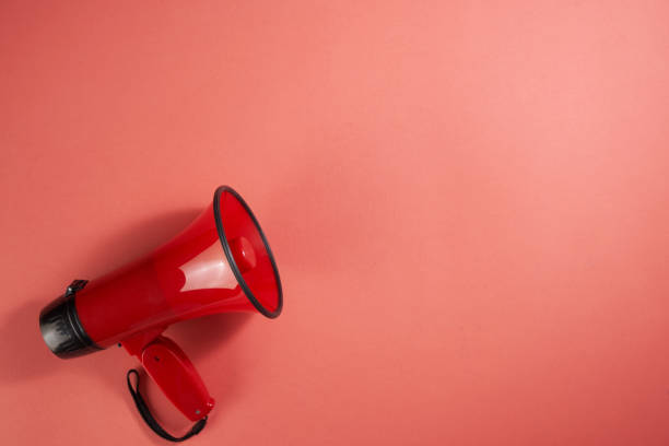 istock red electric megaphone with a handle stands on a red background 1350231779