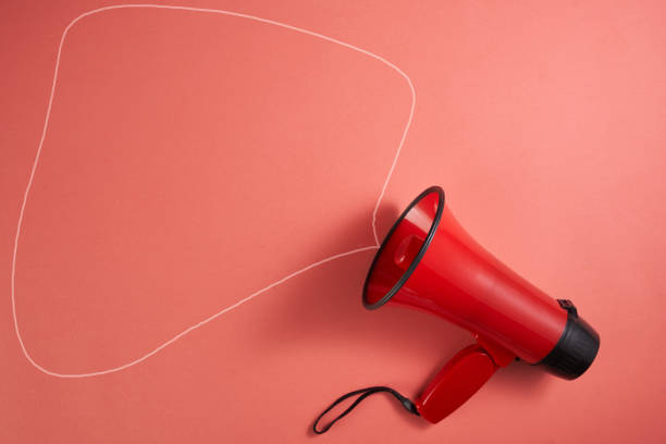 istock red electric megaphone with a handle stands on a red background 1350231781