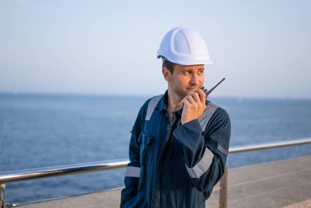 istock Workman speaking on radio set on pier 1350233170