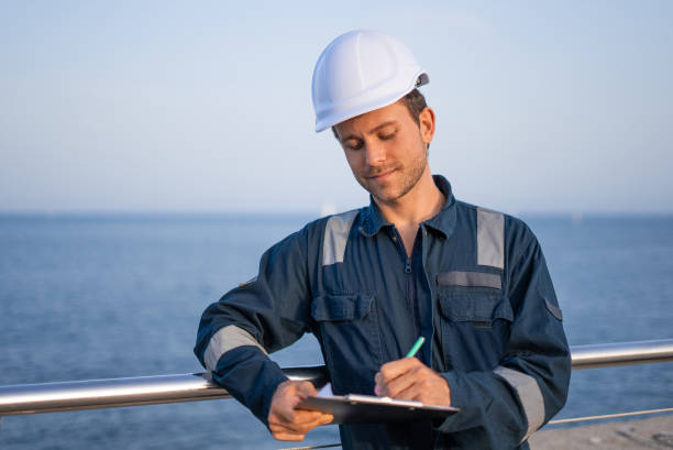 istock Port employee with documents near sea 1350234307
