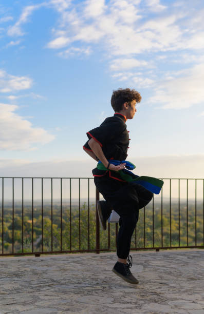 istock young Caucasian man in kimono practicing traditional kung fu. 1350235368