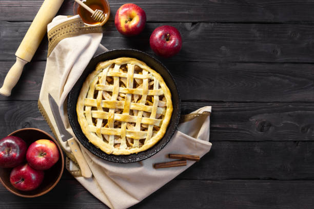 istock Apple pie on a wooden background, top view. Copyspace. 1350236439