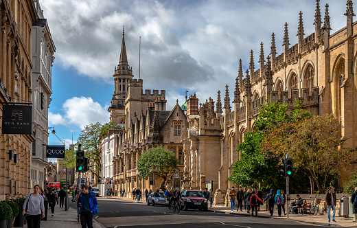 Oxford, UK - September 21 2018: View of the High Street with the University Church of St Mary the Virgin and All Saints Church, now the library of Lincoln College.