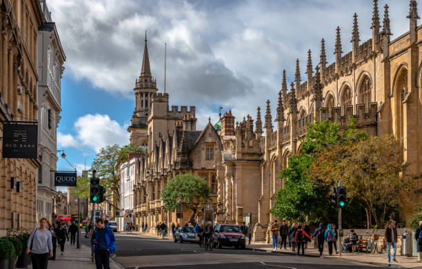 High Street in Oxford, with the Church of St Mary the Virgin and All Saints Church (the library of Lincoln College). Oxford, UK - September 21 2018: View of the High Street with the University Church of St Mary the Virgin and All Saints Church, now the library of Lincoln College. oxford england stock pictures, royalty-free photos & images