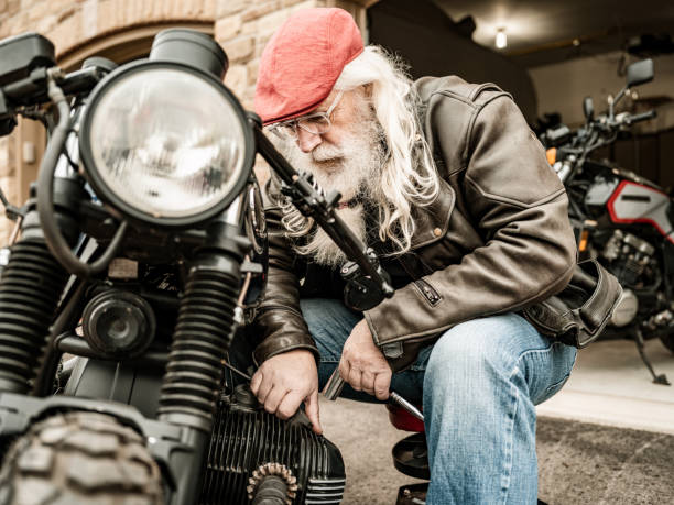 istock Senior man working on his motorcycle 1350238762