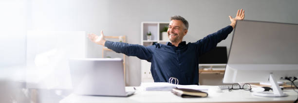 istock Advisor Man Relaxing In Office Chair 1350239073