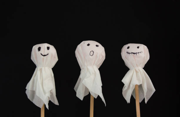 istock Halloween flat lay - bats and ghosts on black background. 1350241622