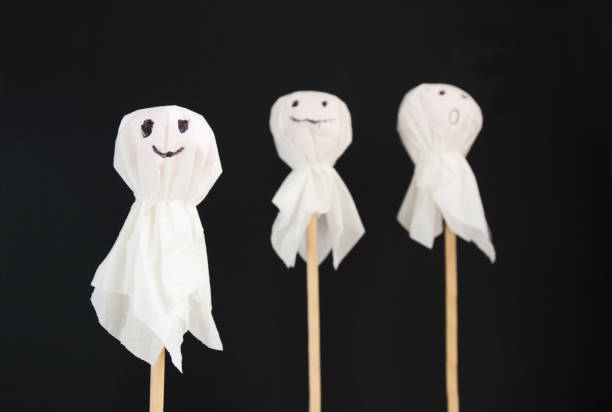 istock Halloween flat lay - bats and ghosts on black background. 1350241676